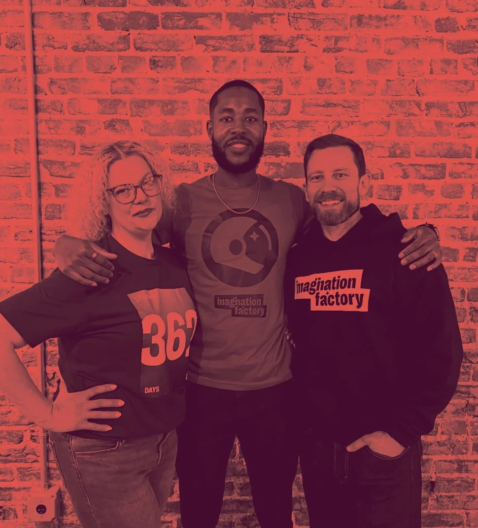 Matt Anderson and Cheri Williams, co-founders of Imagination Factory, with a community member at a program event
