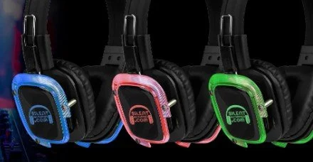 Three pairs of gaming headphones with colored ear cups in blue, pink, and green, displayed against a black background.