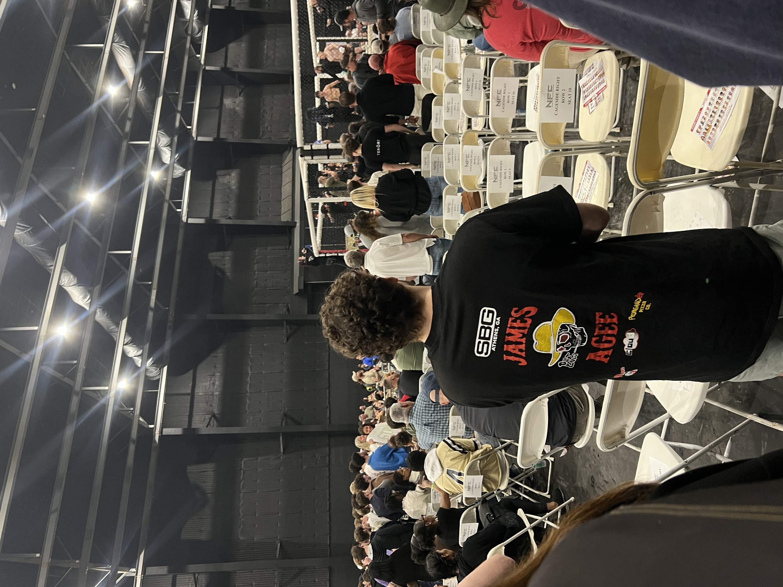 Fan wearing my shirt design in crowd. Feb. 2026