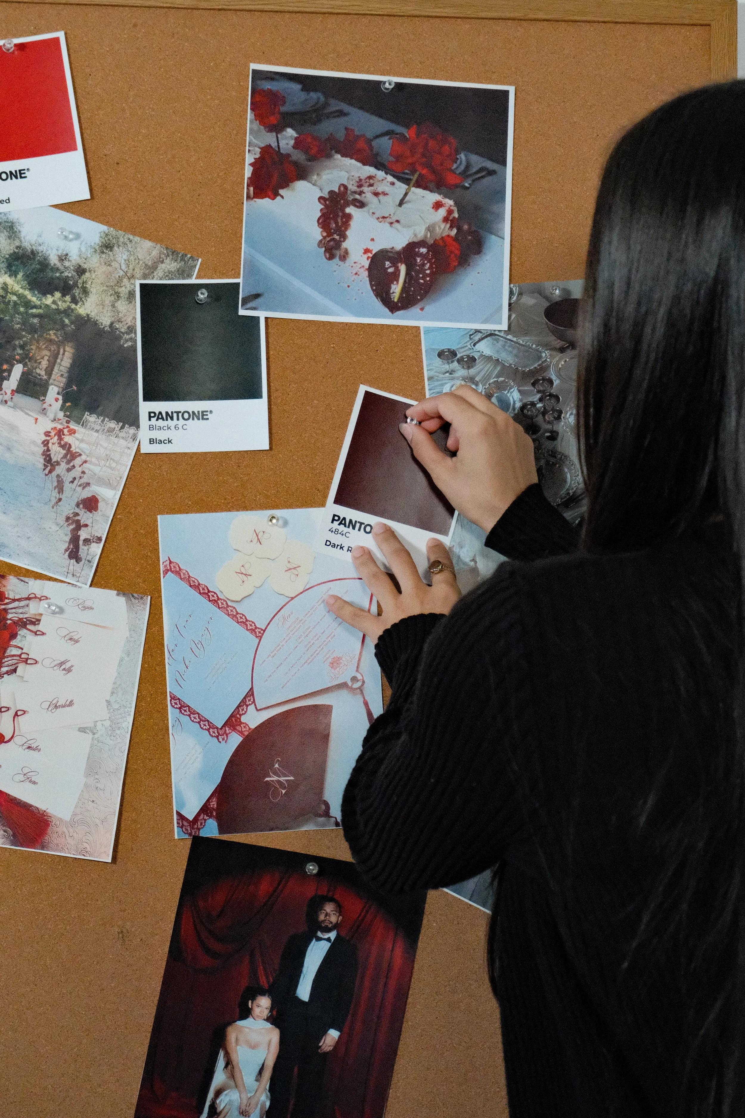 Wedding designer curating a creative concept board with color palettes, stationery inspiration, and visual design references