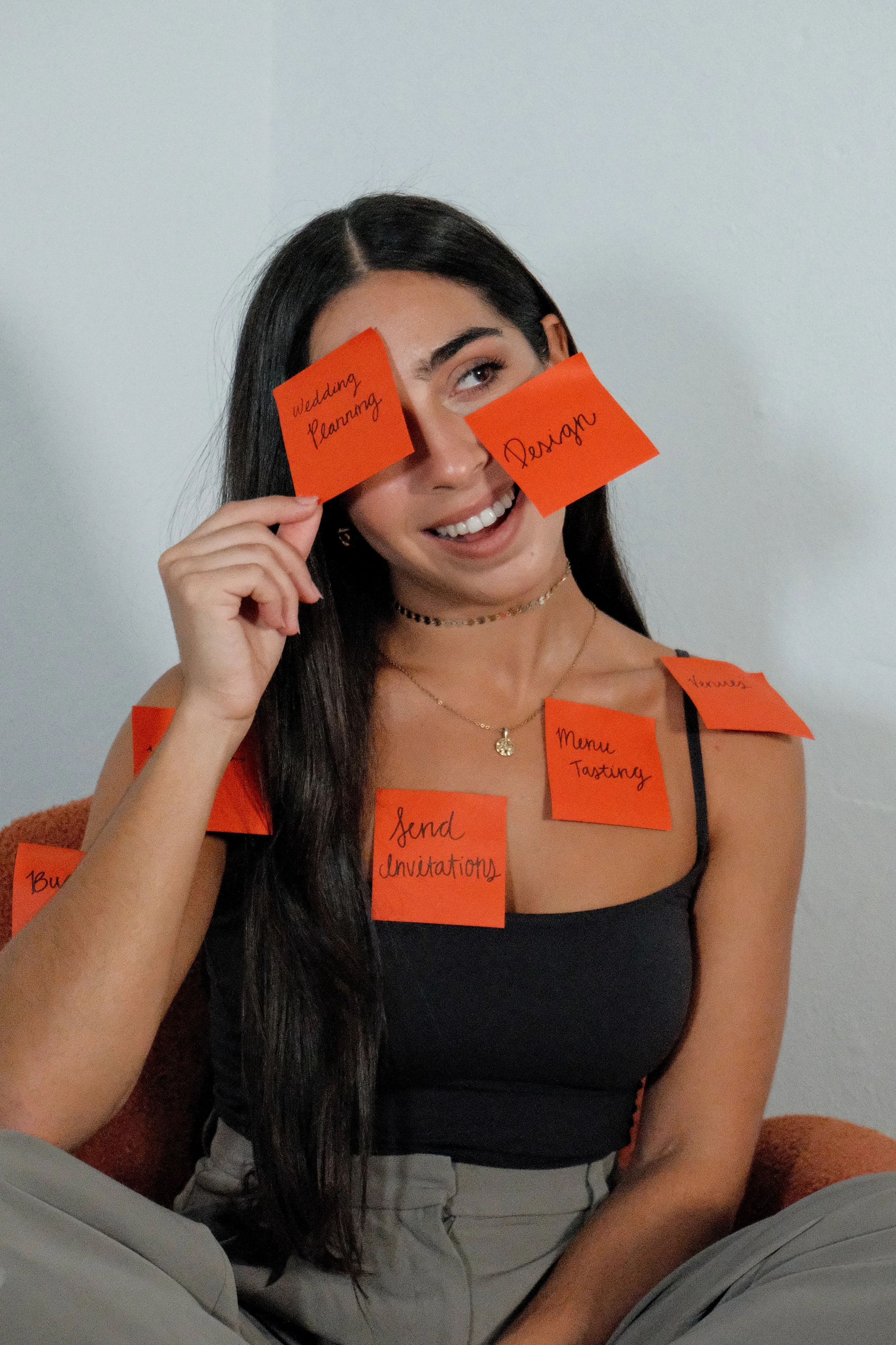 Amanda Rojas, founder of Amare Events & Design, playfully highlighting wedding planning tasks and behind-the-scenes coordination