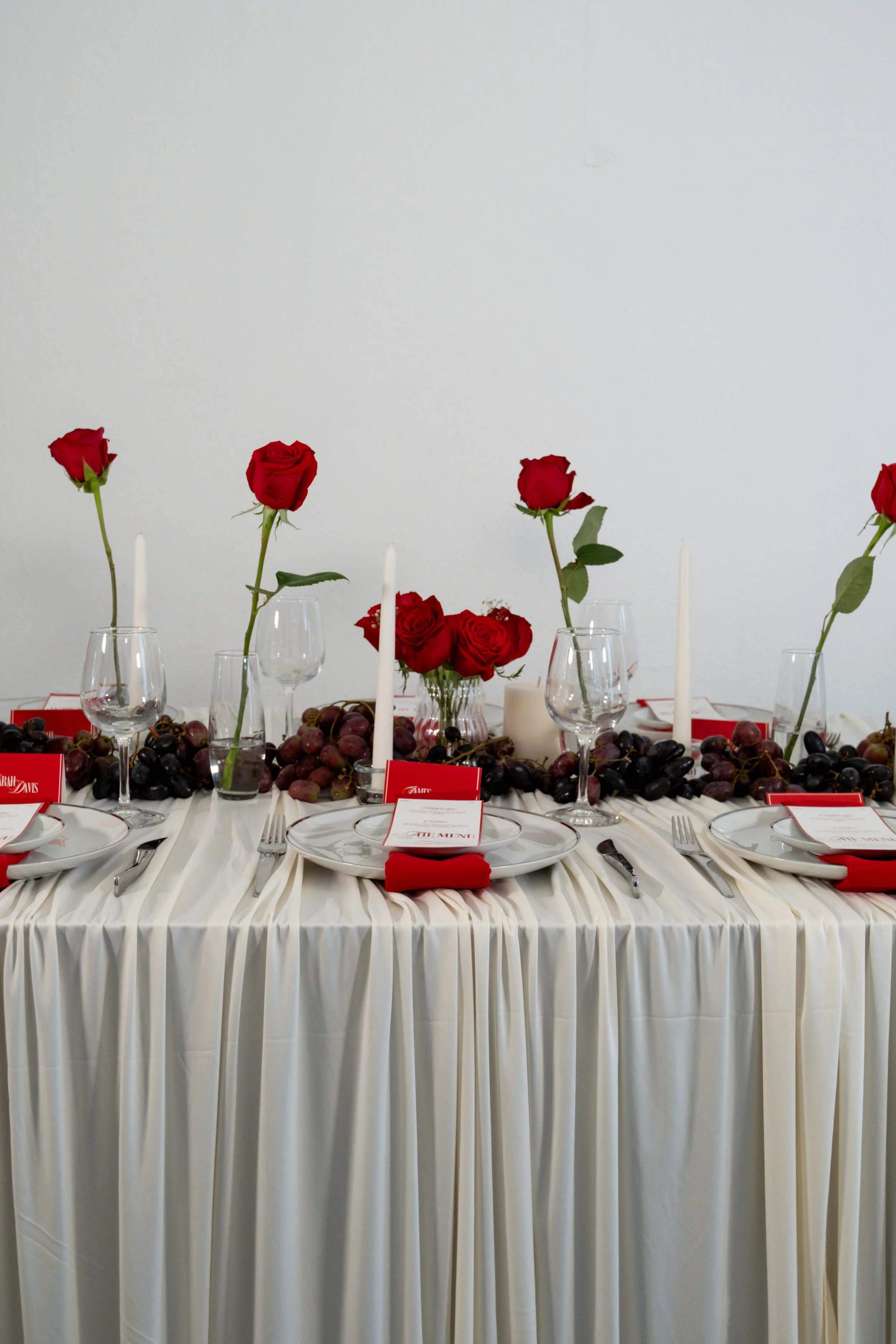 Styled wedding tablescape with curated florals, custom stationery, and elevated guest dining design