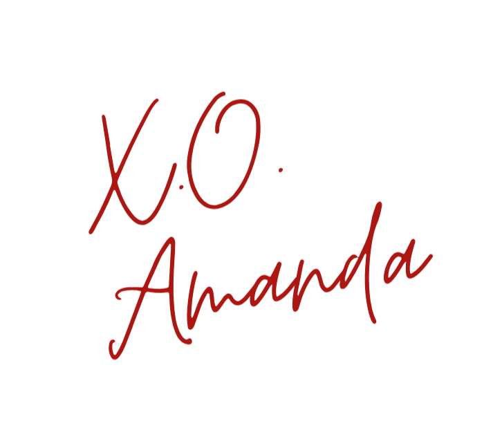 Handwritten text saying 'X.O.' and 'Amanda' in red ink on a black background.