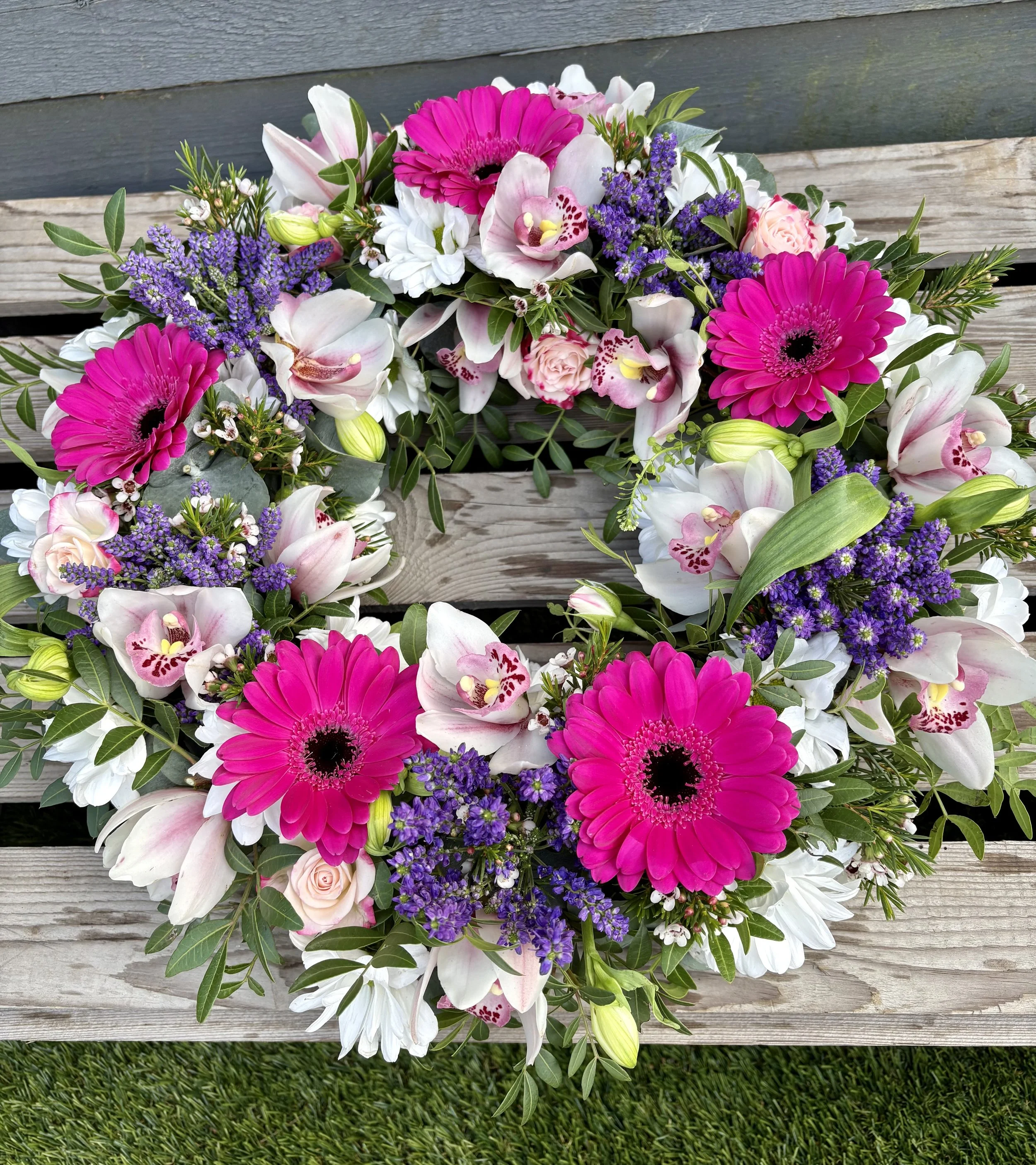 Gerbera and orchid funeral wreath