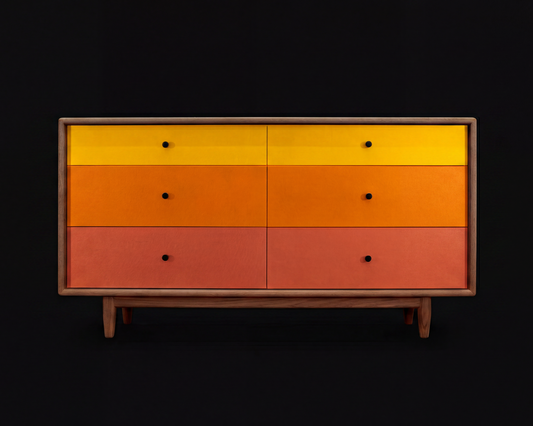 Colorful wooden cabinet with six drawers in yellow, orange, and red, set against a black background.