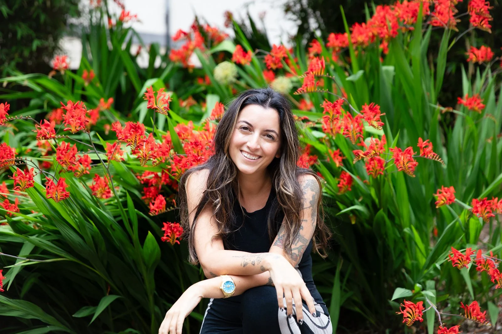 Headshot of therapist in front of flowers