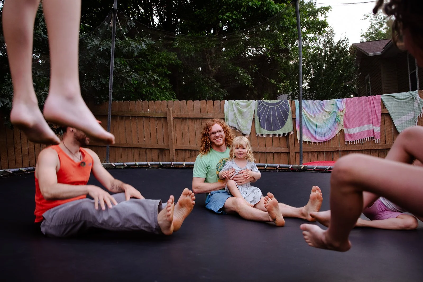 Family jumping on a trampoline
