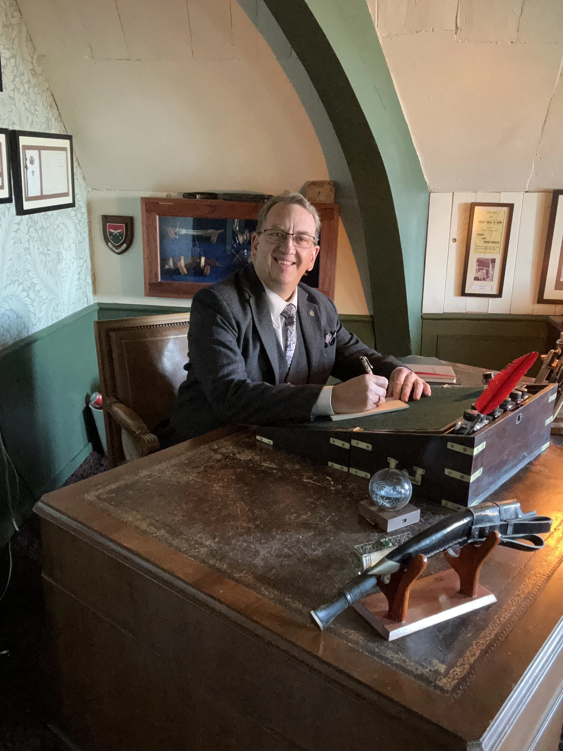 Jasper Brooke writing novels at a desk