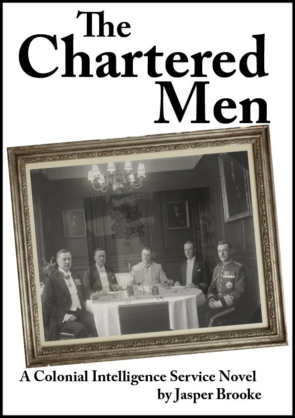 Book cover of 'The Chartered Men,' a colonial intelligence service novel by Jasper Brooke, featuring a black and white photograph of five men in formal attire seated at a dining table, inside a richly decorated room with framed pictures and a chandelier.