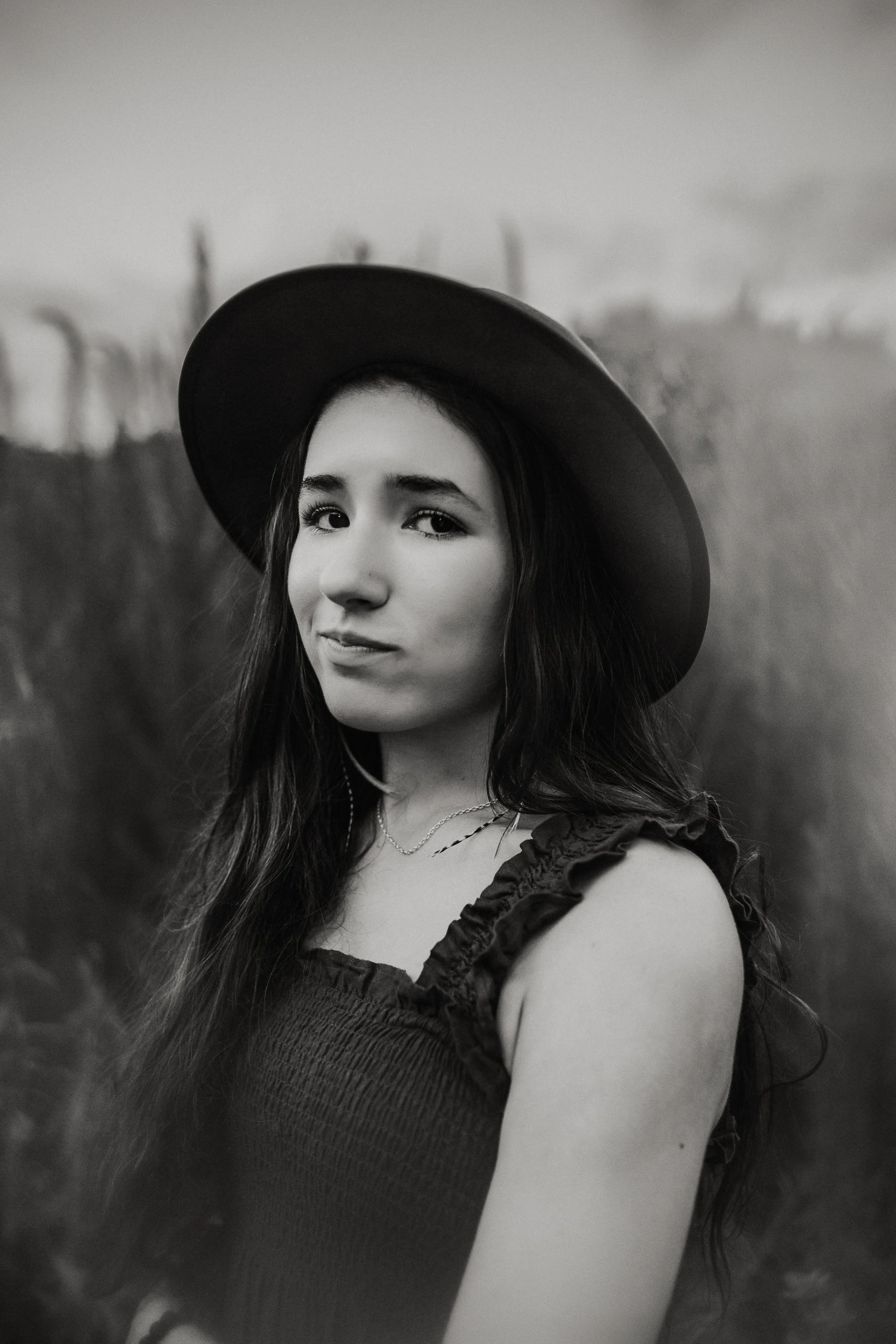 A black and white photo of Claire. The photographer behind nomadiclens.co