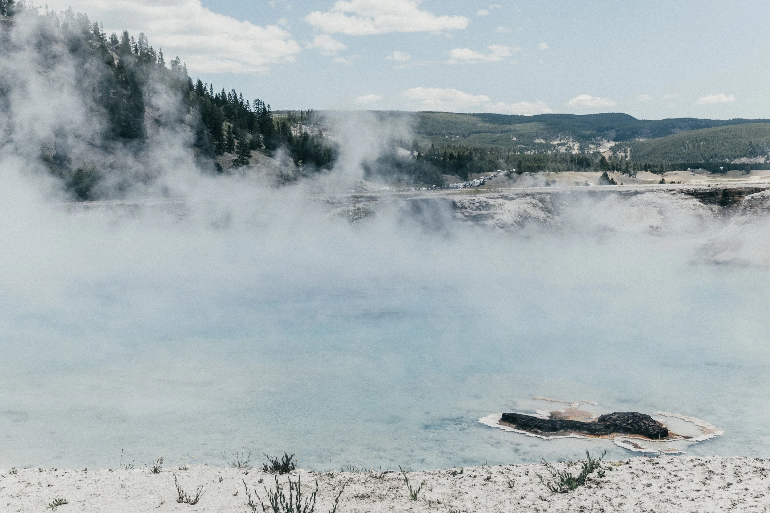 Yellowstone National Park prismatic steaming blue pool.