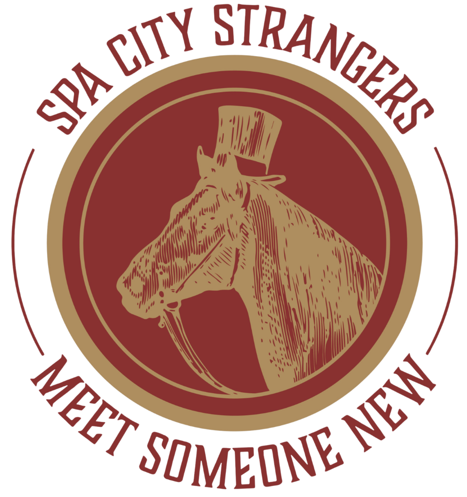 A circular emblem with a gold horse wearing a top hat in the center. Surrounding the horse are the words "Spa City Strangers" at the top and "Meet Someone New" at the bottom, both in maroon letters.