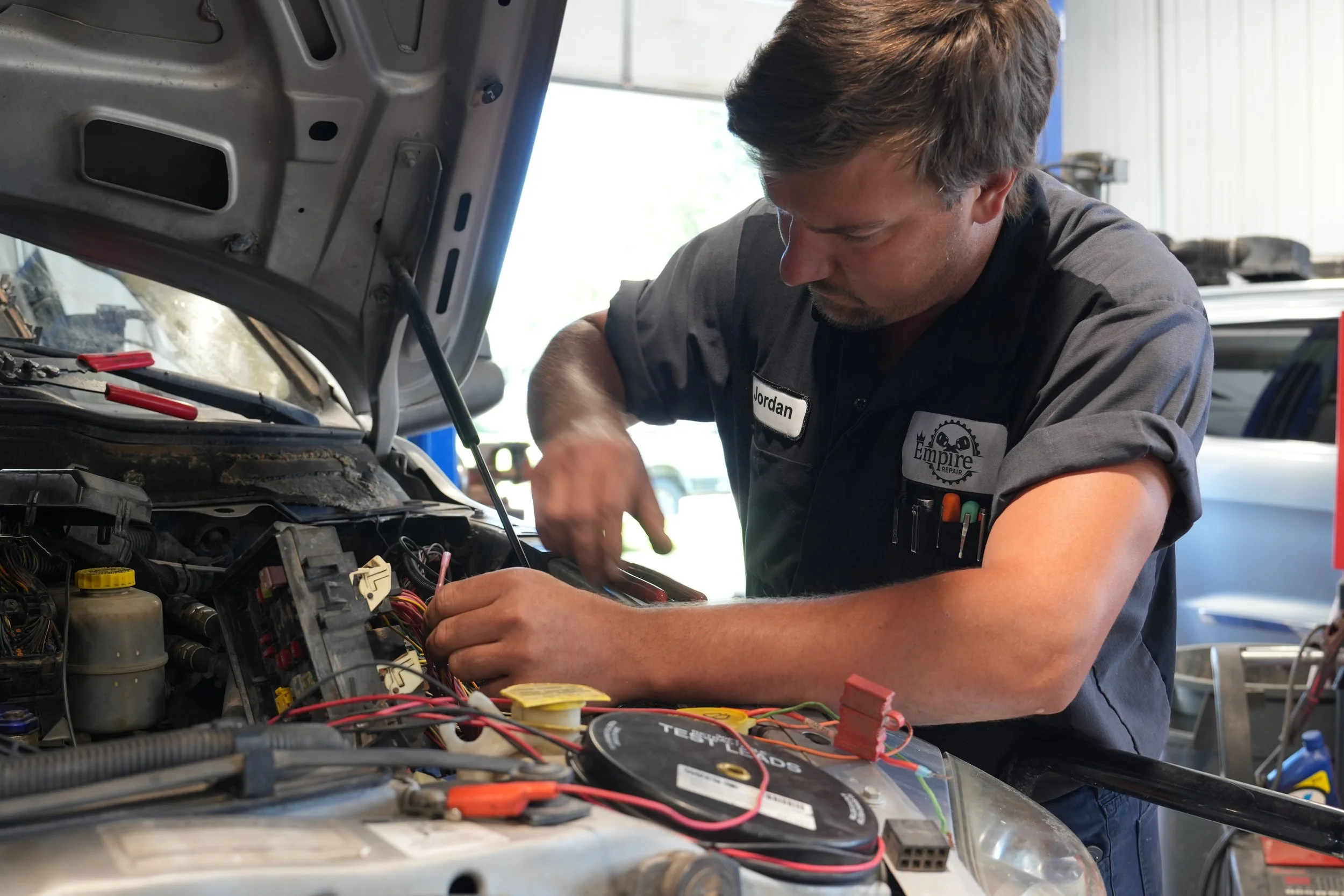Empire Repair mechanic diagnosing electrical system on a vehicle in Waverly, NE