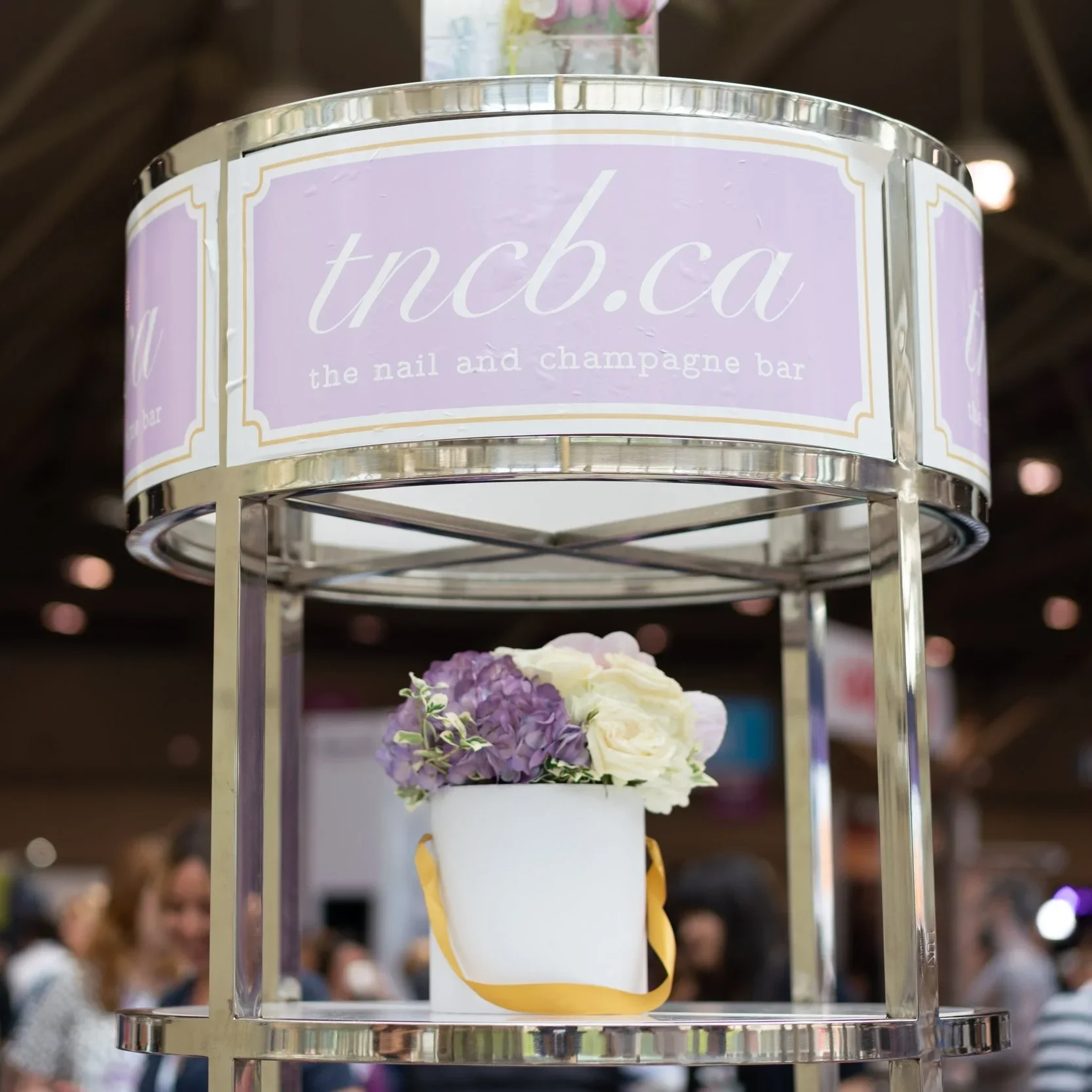 The Nail and Champagne Bar (TNCB) on-site corporate event activation signage