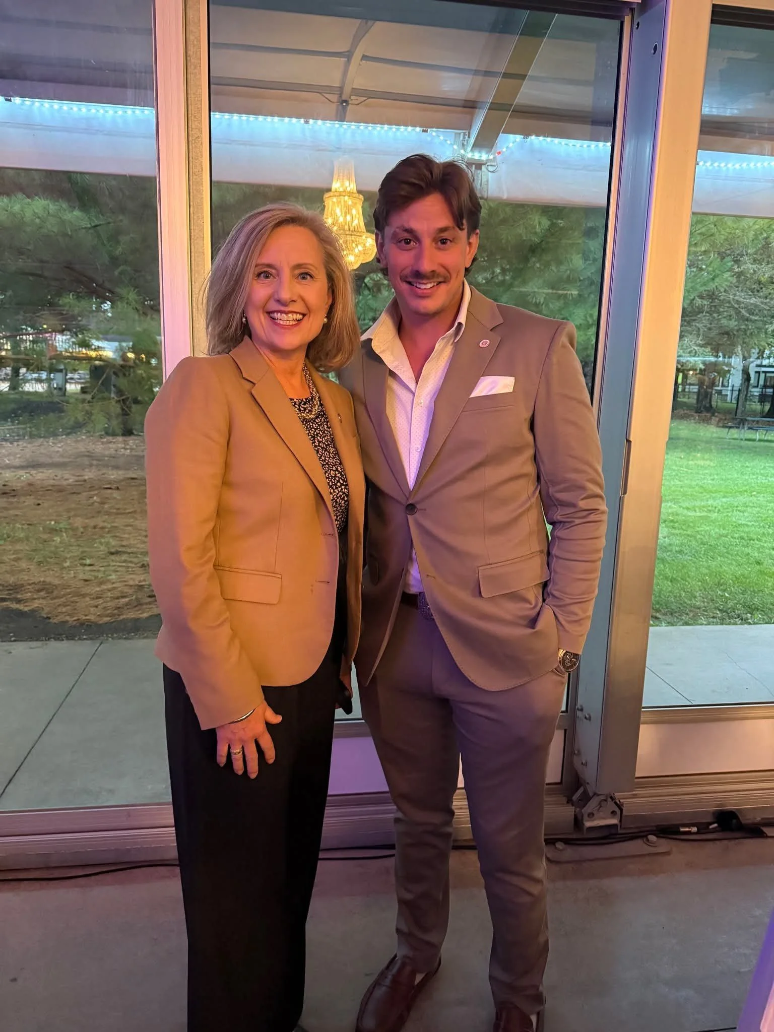 AJ Gubash standing with Kristen Robbins at an event in Minnesota.