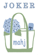 Illustration of a shopping bag with blue flowers, a blue mailbox, and the words 'Joker Mahj' inside the bag.