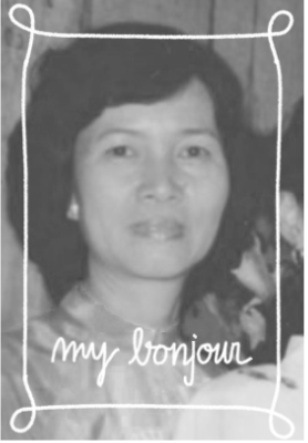 Black and white photo of a woman with short hair, framed with a decorative border, with the words 'my bonjour' written at the bottom.