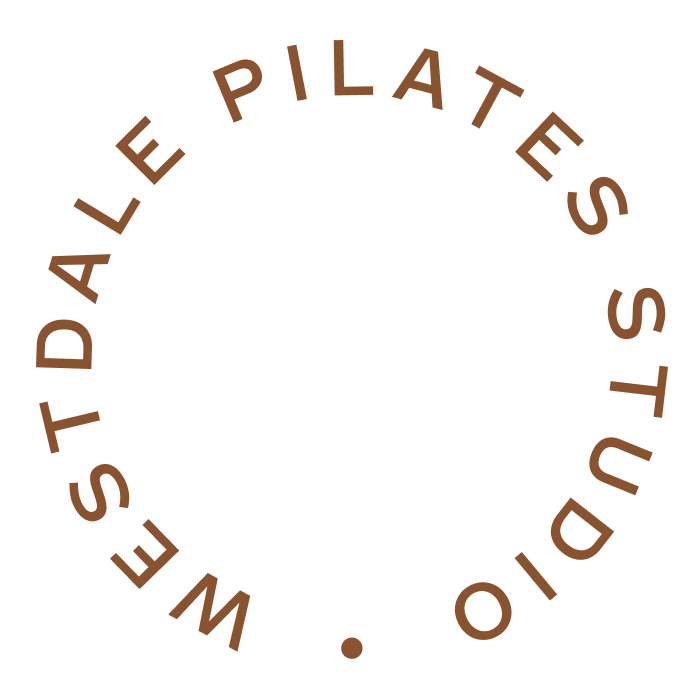 Circular logo with the text 'WES TALD ALE PILATES STUDIO' arranged around the perimeter in brown font.