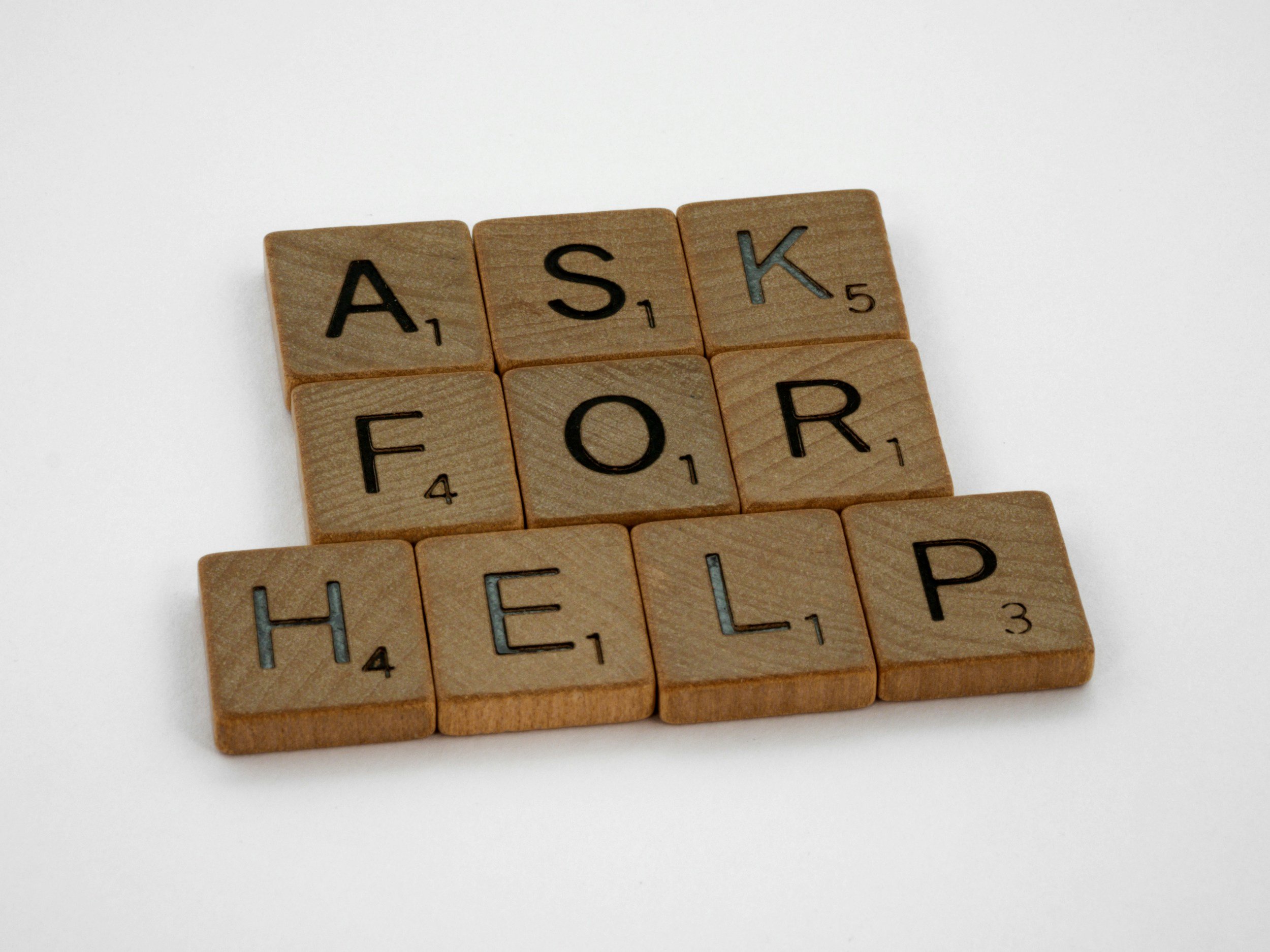 Jesus Cares - Scrabble pieces that spell, "Ask For Help"