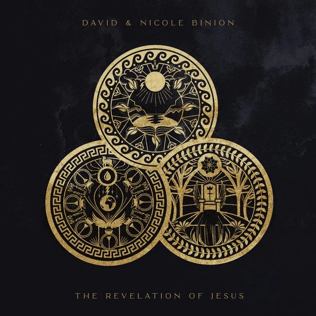 Gold embossed artwork featuring three circular, intricate designs on a black background. The top circle depicts a sun, mountains, and water. The bottom left circle shows celestial symbols, a globe, and a bird, with a border of geometric patterns. The bottom right circle illustrates a fountain, plants, and an eye, framed by a leafy border. Text above reads "David & Nicole Binion" and below, "The Revelation of Jesus."