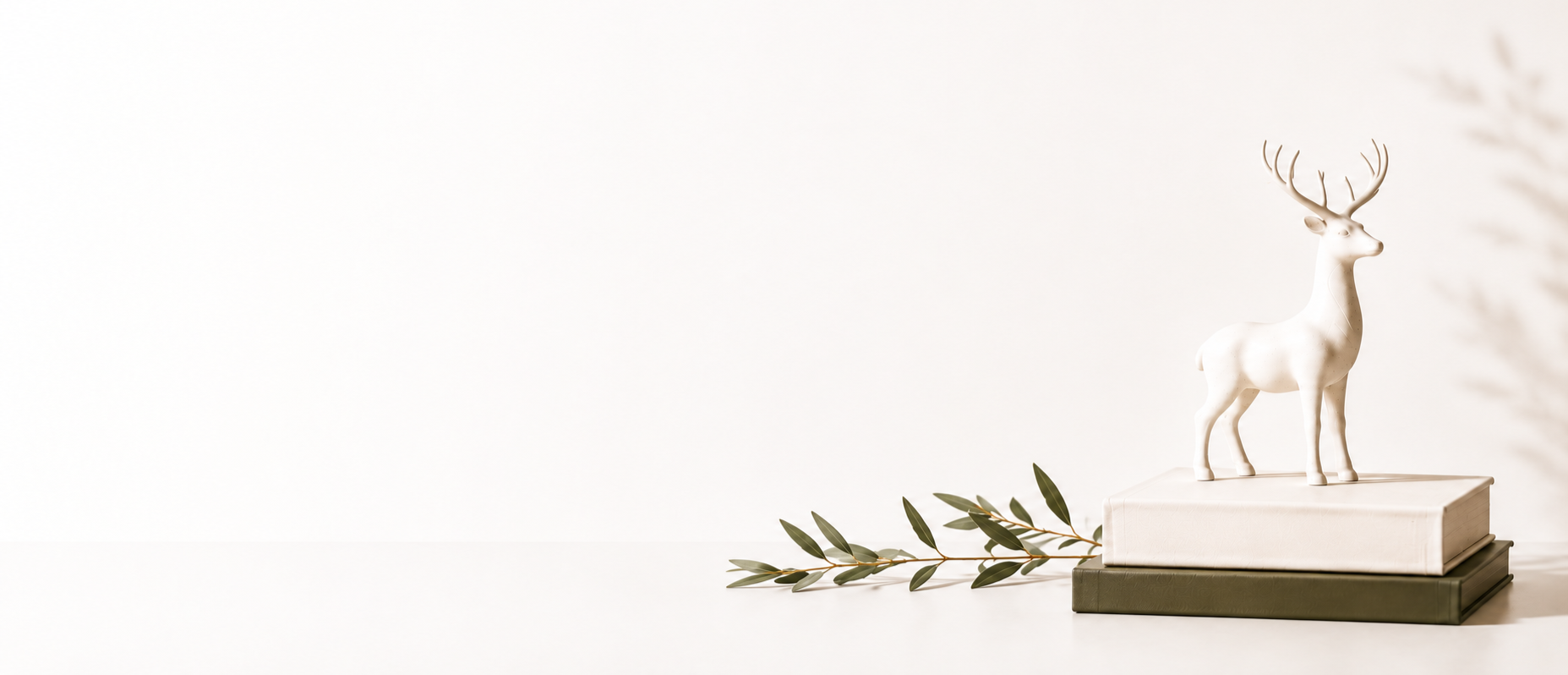 StandOut Leadership Consultancy brand icon with a white deer figurine on books for professional development.