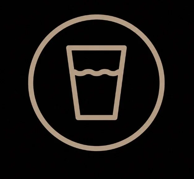 Icon of a glass filled with water, enclosed in a circle
