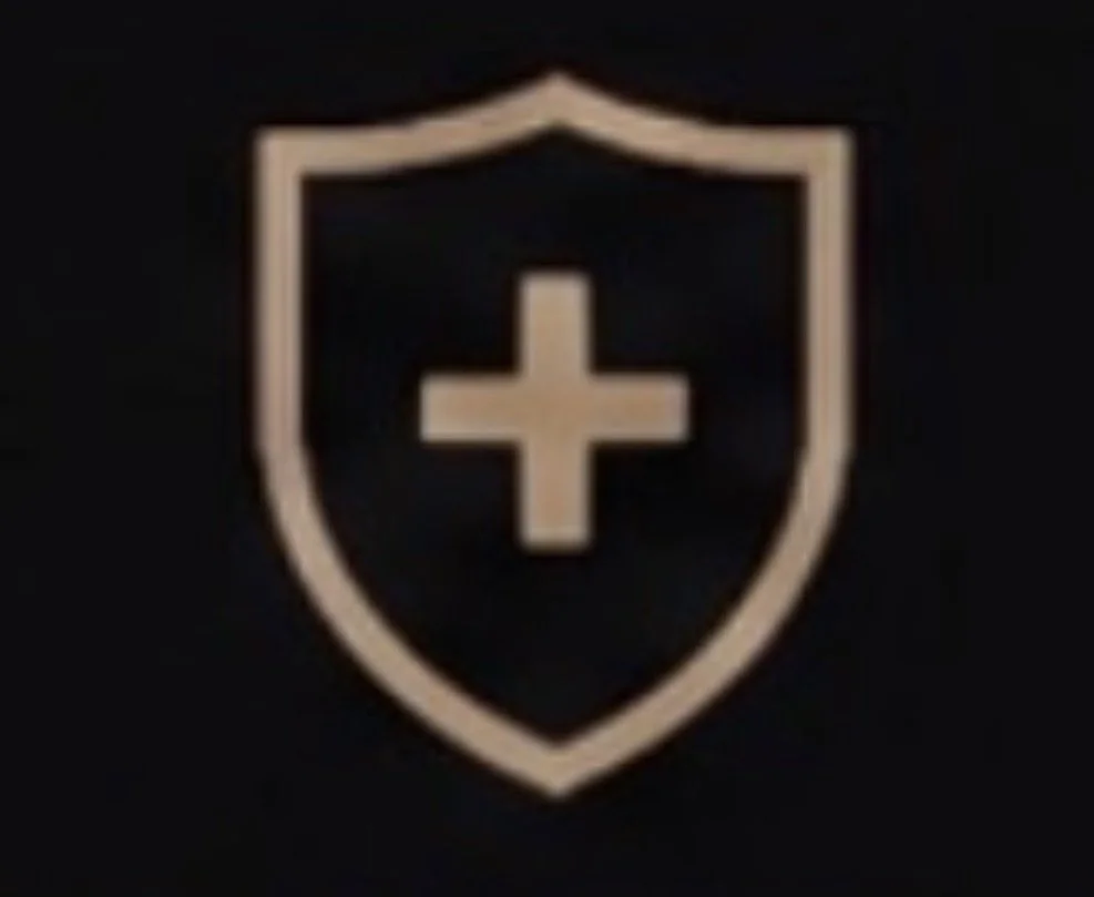 A shield logo with a cross in the center, outlined in beige on a black background.
