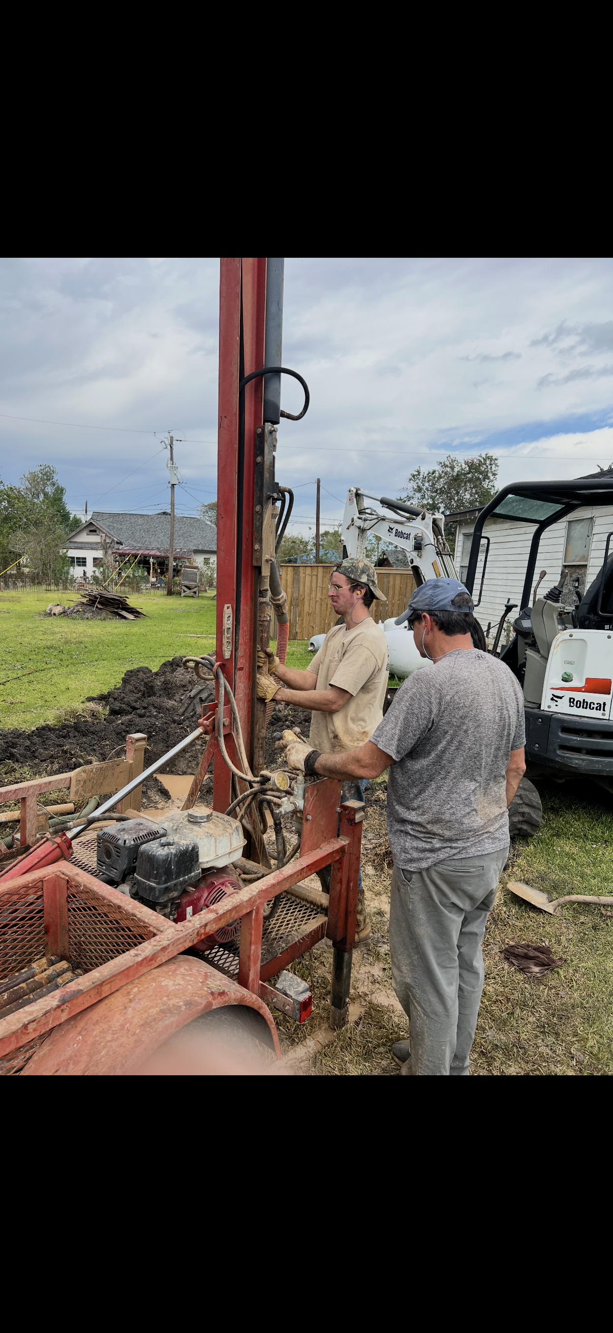 Residential water well drilling and installation crew onsite