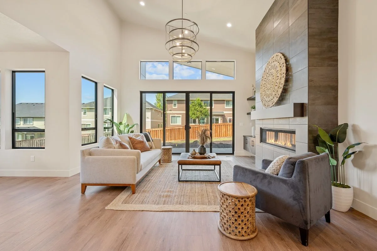 modern-great-room-gas-fireplace-chandelier-natural-light-pacific-nw.jpg