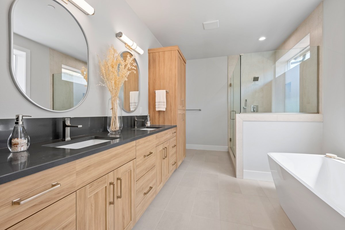 modern-bathroom-design-round-mirrors-wood-vanity-vancouver-wa.jpg
