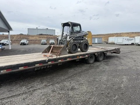 Bulldozer loaded on step deck trailer for heavy haul transport – Prime Load Solutions