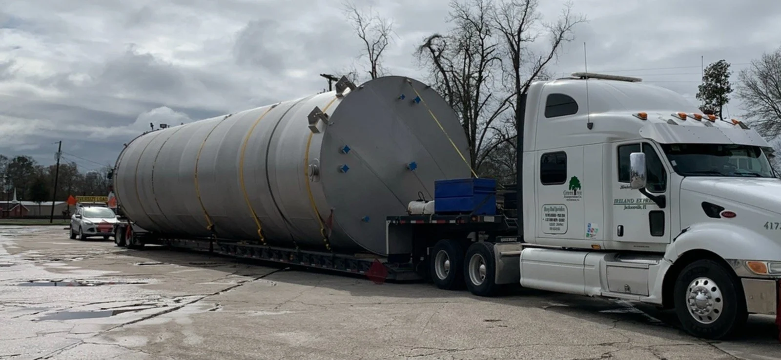 Large industrial tank transported safely on flatbed – Prime Load Solutions on-time delivery