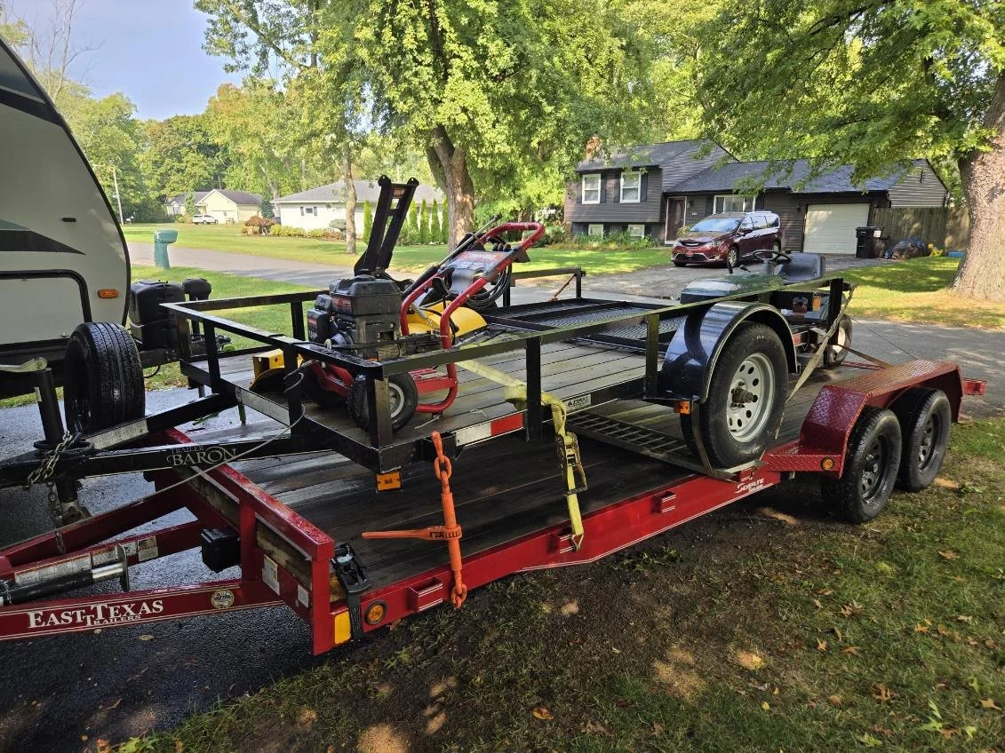 Heavy equipment on dual axle trailer ready for hotshot delivery – Prime Load Solutions LLC