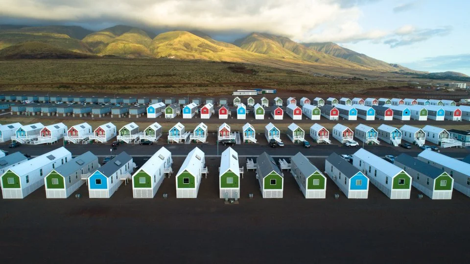 Fading West disaster relief housing in Lahaina, Maui — colorful modular homes with mountain backdrop delivered as FEMA wildfire housing after the 2023 Lahaina fires.