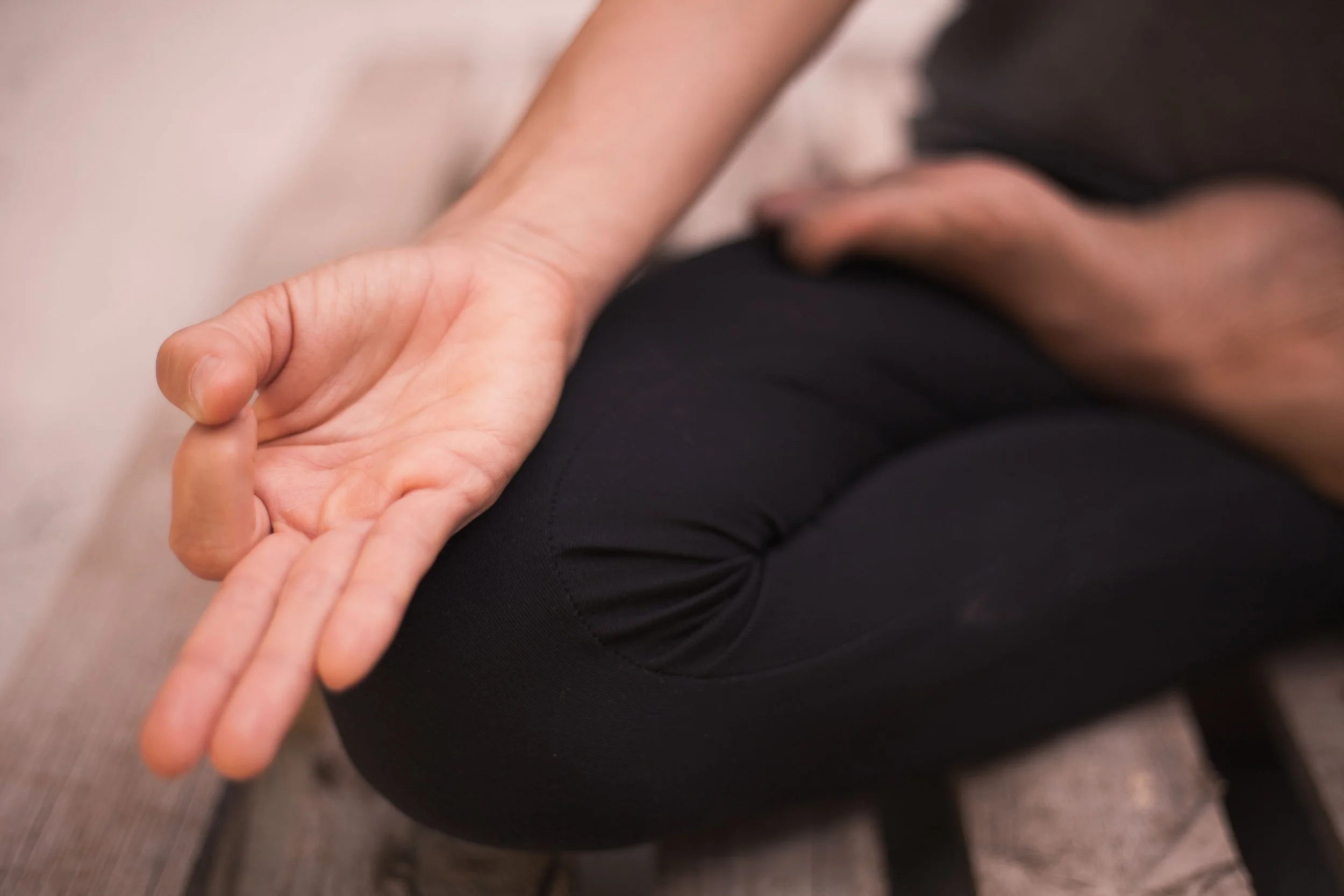 A close up of a hand of a yoga student practicing appreciation at Peaceful Yoga in Long Island New York