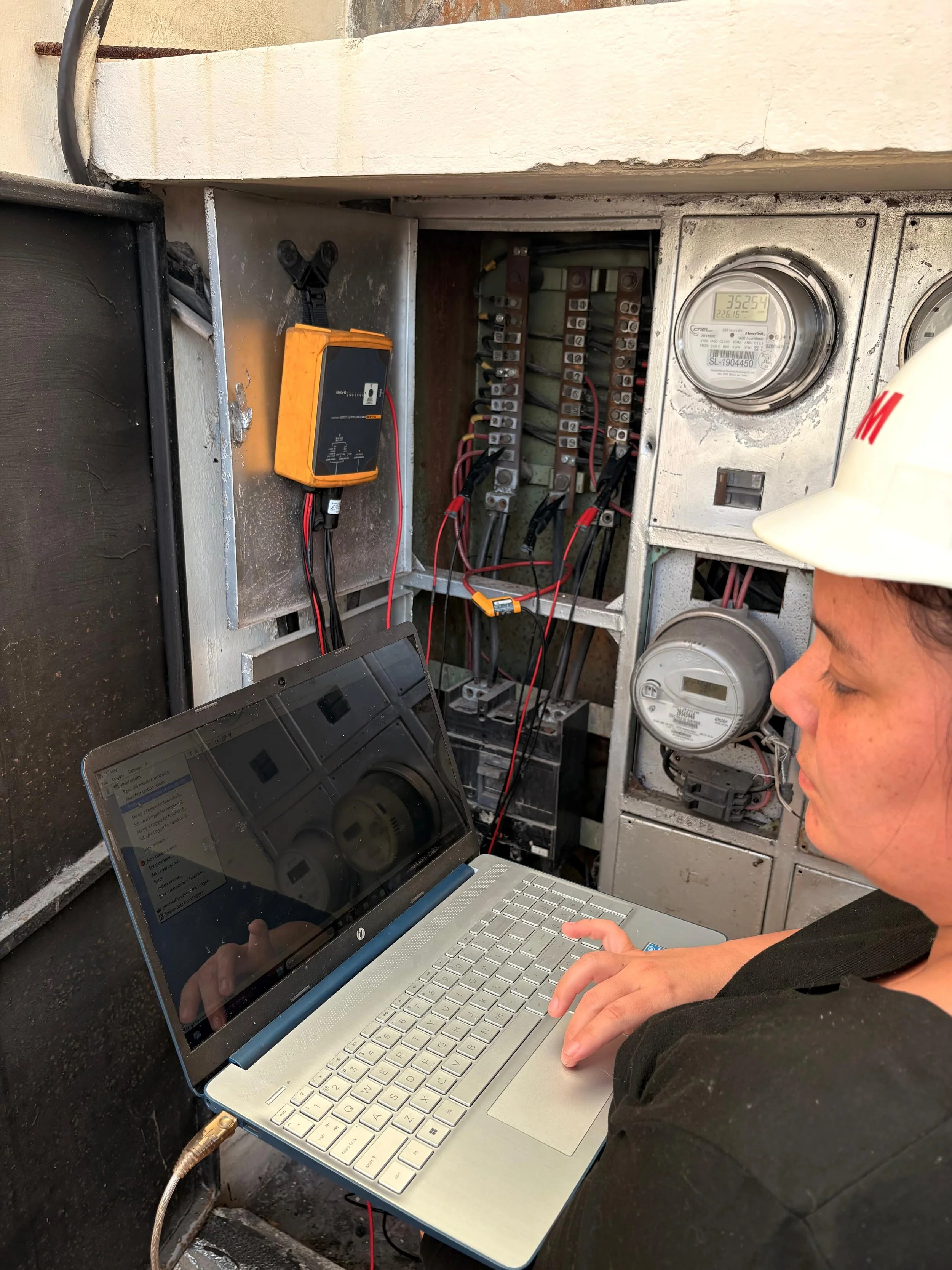 Oranssi technician working on a roof project