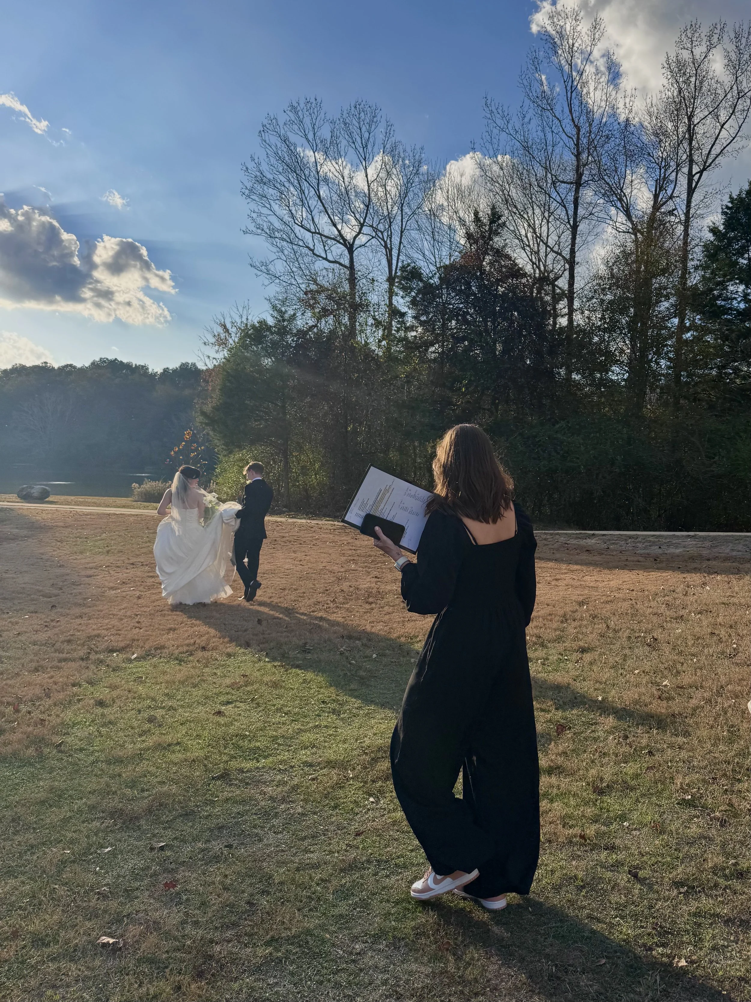 Shelly assisting a bride and groom on their wedding day.