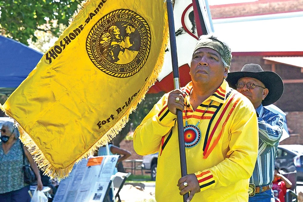 Ladd Edmo carries tribal flag.jpg