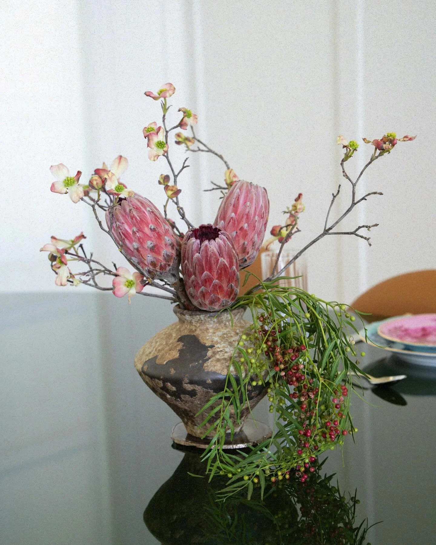 Proteas, dogwood branches &amp; pepper berries. Wild at the base, sculptural at the top.
$240 with vase &middot; Delivery not included &middot; DM to book.​​​​​​​​​​​​​​​​ Flowers may vary by season.