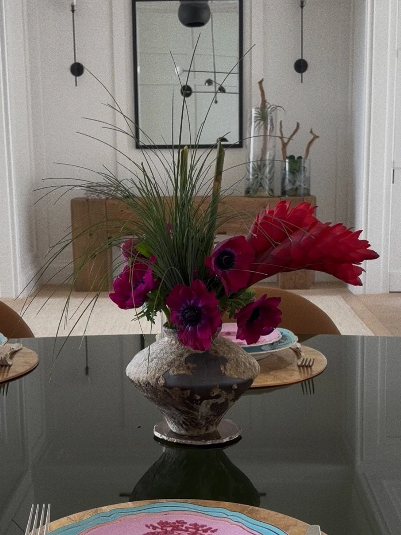The table was already set for something special. We just added the flowers.
Deep purple anemones, torch ginger, and wild grass in a brutalist ceramic vase.
Available for your home or next dinner &mdash; DM to book &middot;