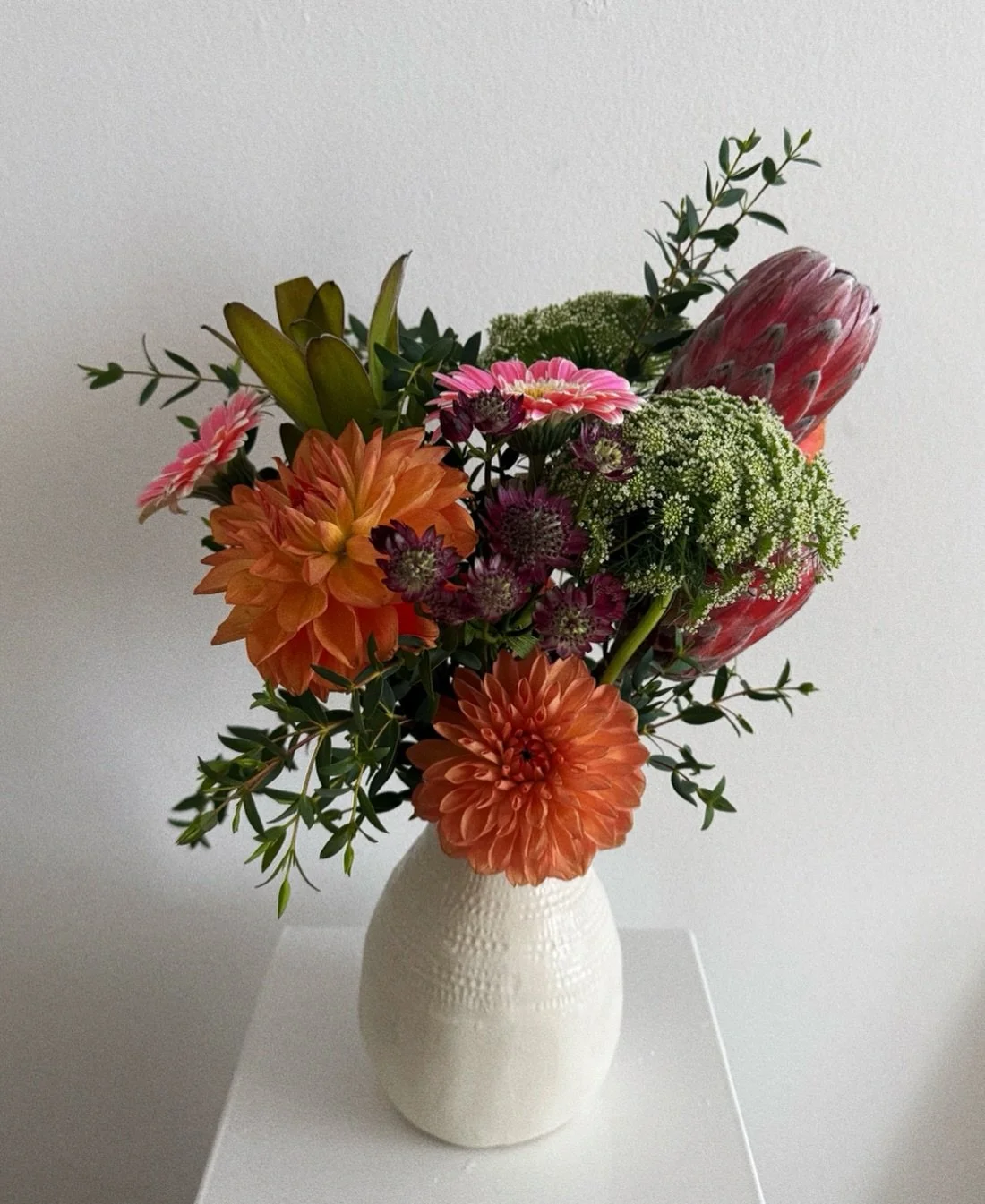 Dahlia, protea, gerbera, queen Anne&rsquo;s lace &mdash; each one chosen with intention. $150 &bull; DM to order