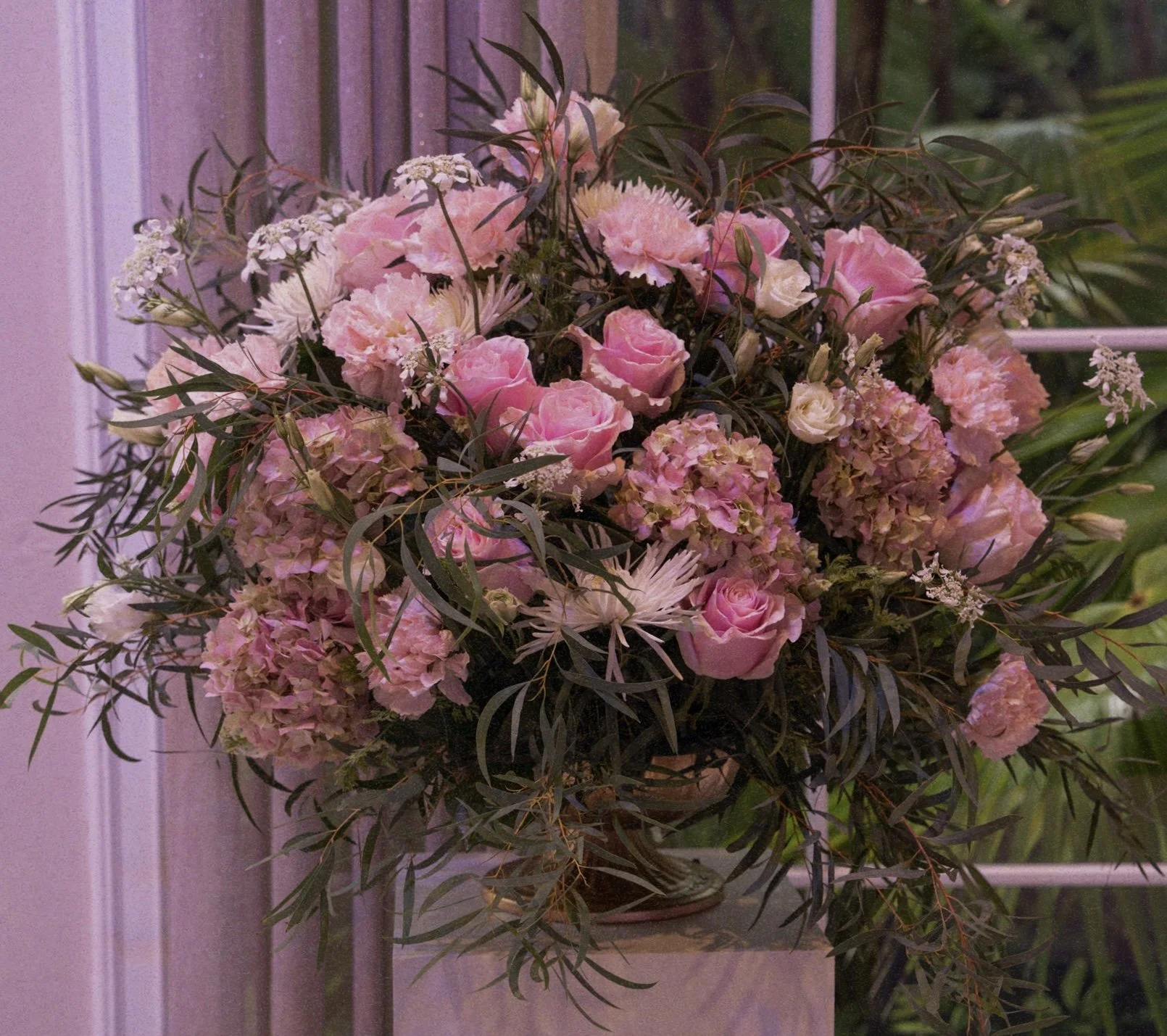 Wedding ceremony large arrangement with Roses, Hydrangeas and Eucalyptus.