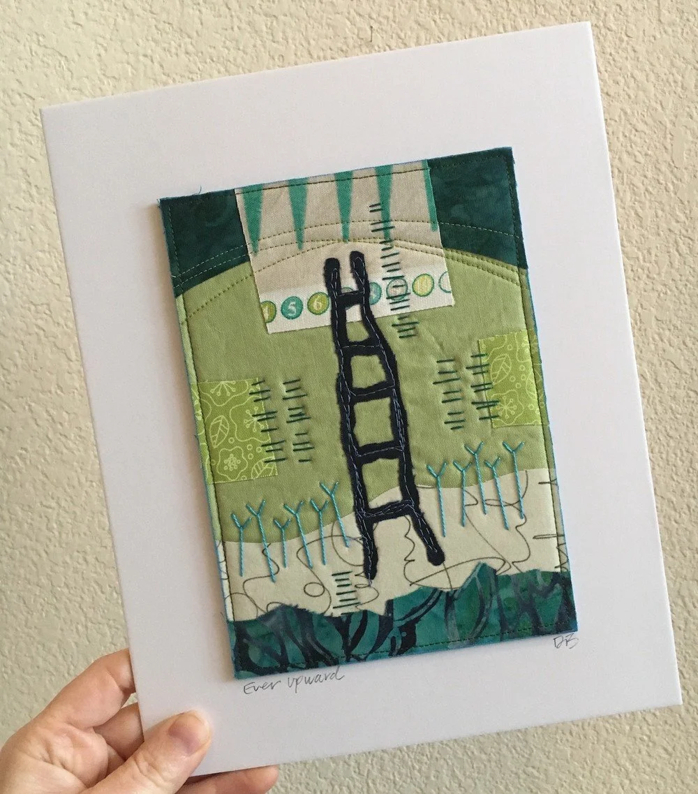 A fabric art piece depicting a black ladder extending upward, surrounded by green and blue patterned fabrics, with stitched details and the handwritten words "Ever upward" at the bottom.
