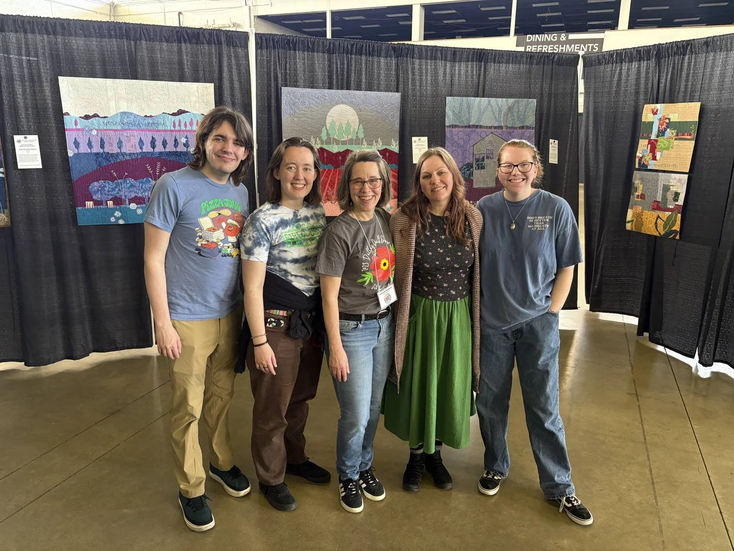 Deborah Boschert with the volunteer hanging team that helped install her Dallas Quilt Show special exhibit.