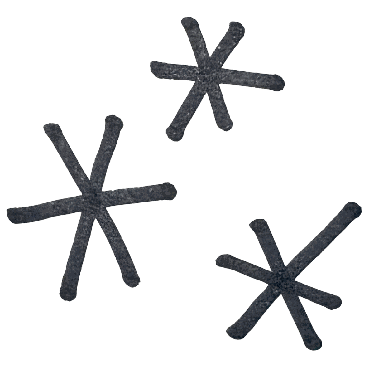 Three black, star-shaped objects with six spokes each, floating against a black background.