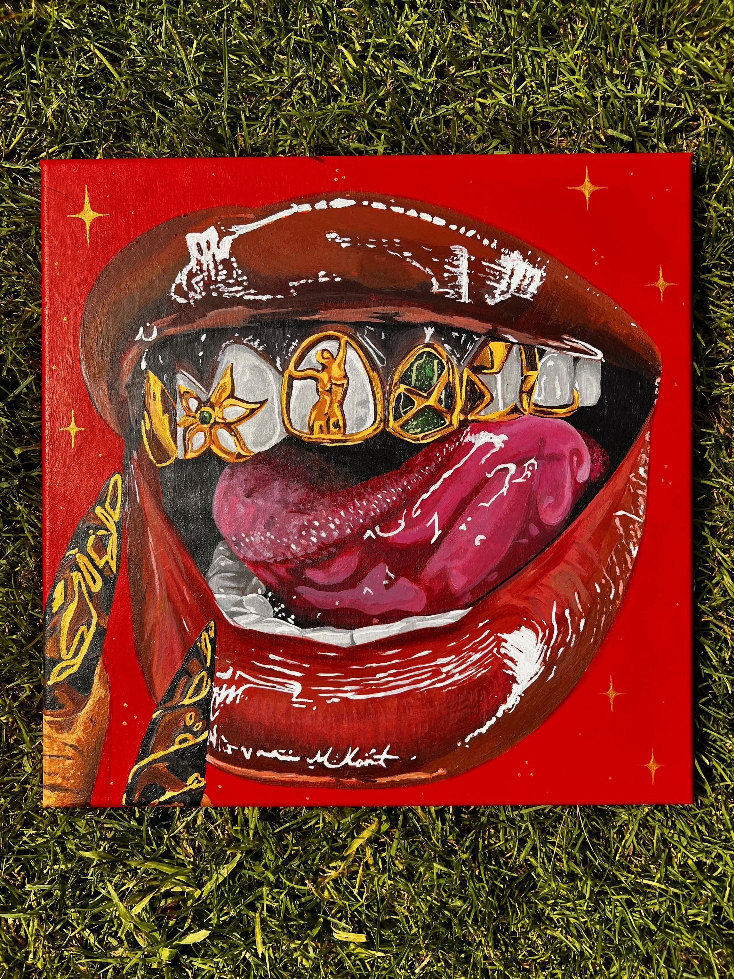 A colorful painting of a person's mouth with red lips, showing teeth with gold jewelry, against a red background with gold stars.