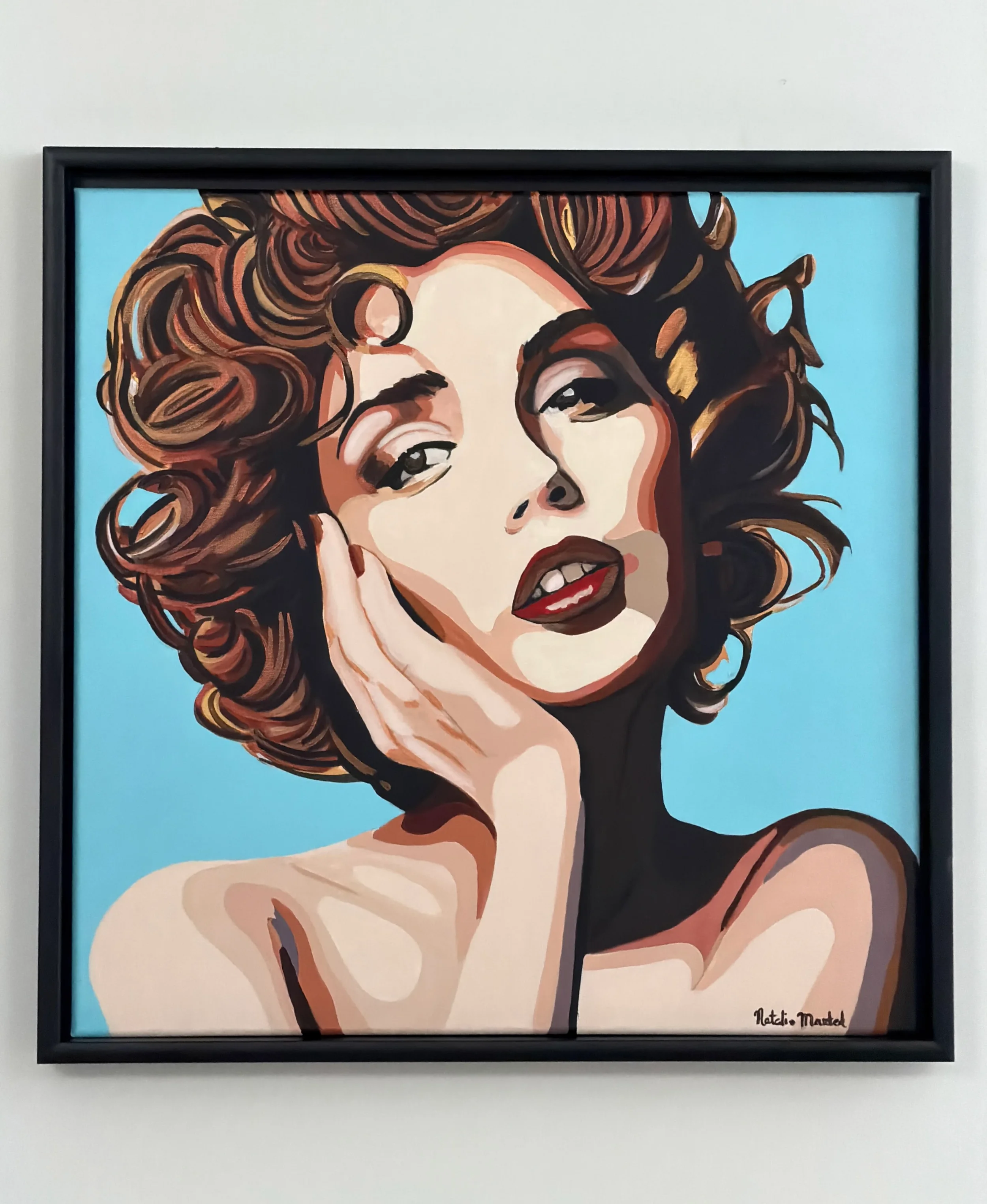 Pop art style portrait of a woman with curly brown hair, fair skin, and red lipstick, set against a blue background, signed by Nattie Mistel.