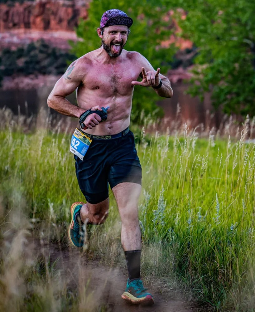 Brendan O'Hara running a trail race — founder of Middle Men and host of the Middle Men Podcast