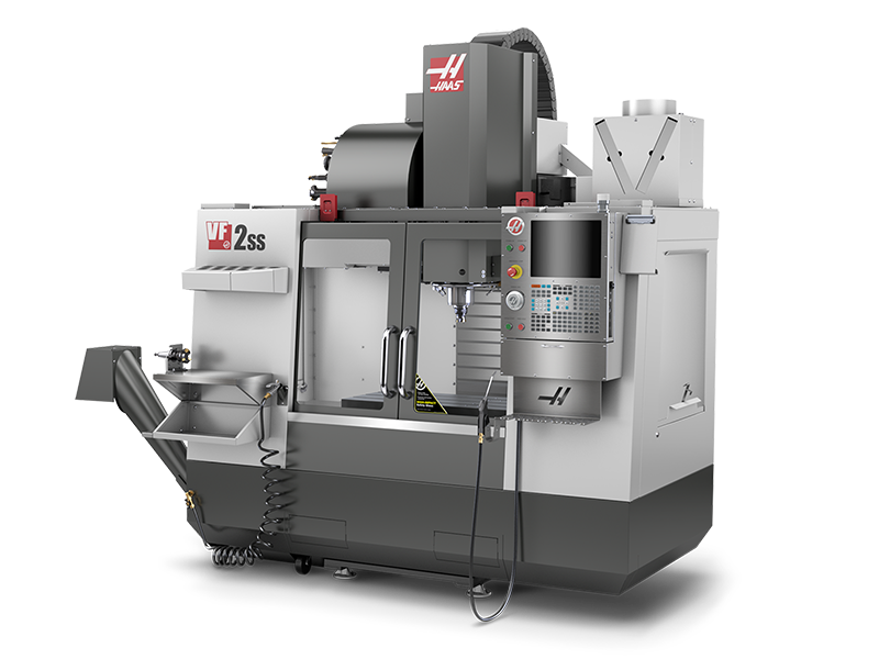 A large industrial CNC milling machine with Haas branding, featuring a computer interface for programming and control, and a cutting area equipped with a spindle.