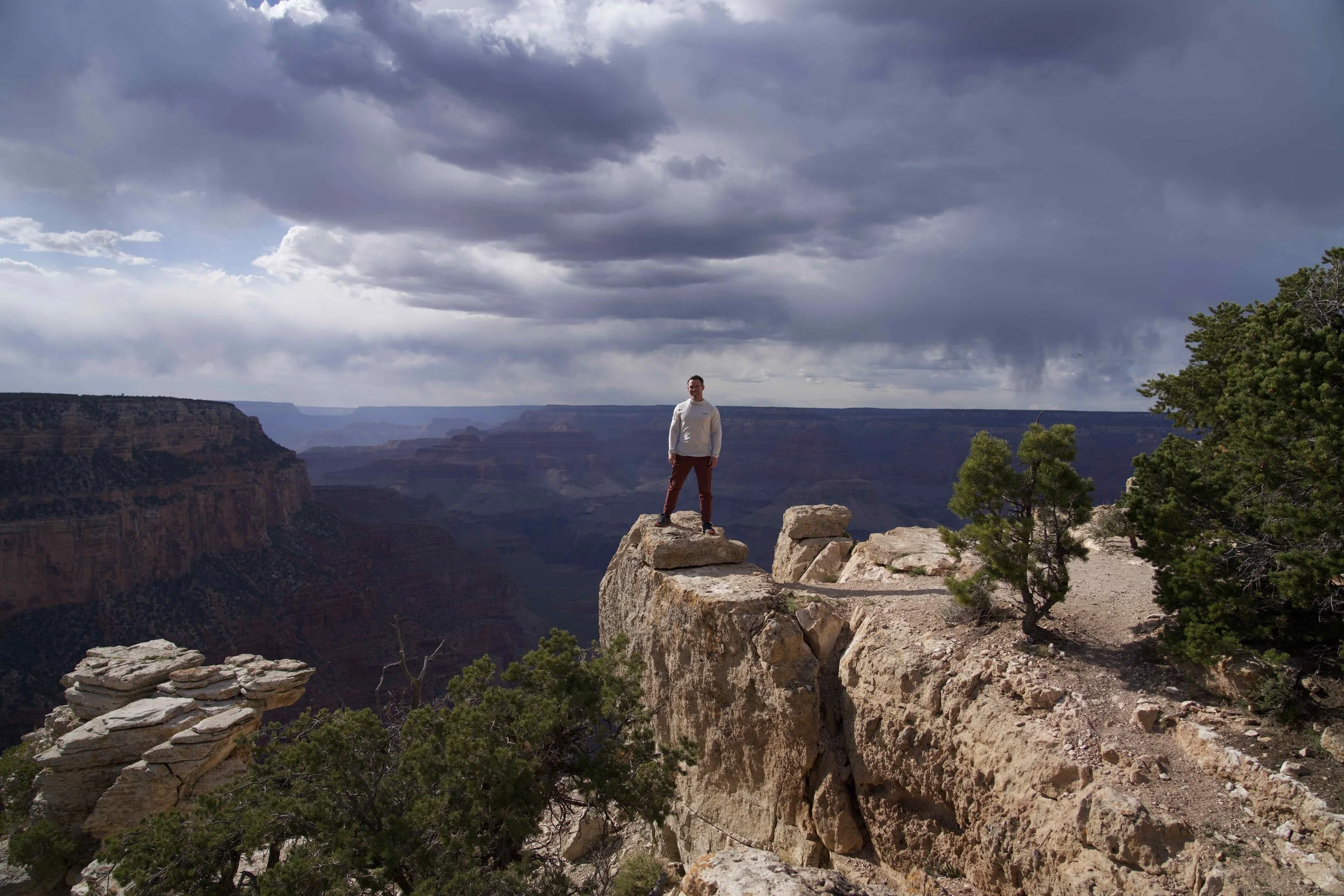 Matt Dalton standing at the Grand Canyon, representing transformation, challenge, and personal growth.